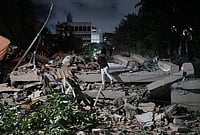 Venezuela Declares Emergency After Century's Most Powerful Twin Earthquakes, Thousands Feared Dead | Photo: AP/Adrian Naranjo : A man jumps on a collapsed building after an earthquake in Caracas, Venezuela.