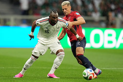 Mexico's Julian Quinones, left, and Czechia's Tomas Holes battle for the ball during a World Cup Group A soccer match in Mexico City, Wednesday, June 24, 2026.