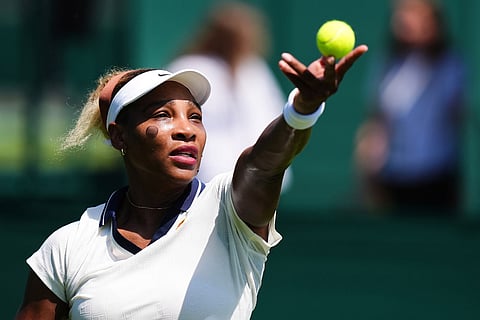 United States' Serena Williams serves during a practice session ahead of the Wimbledon Tennis Championships, at the All England Lawn Tennis and Croquet Club, in London.