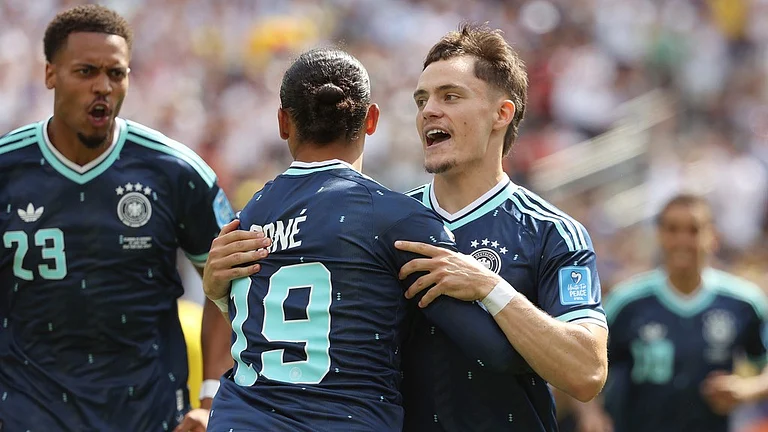 Germany's Leroy Sane (19) celebrates after scoring his side's first goal against Ecuador with Germany's Florian Wirtz, right, and Felix Nmecha (23) during the World Cup Group E soccer match in East Rutherford. - AP Photo/Pamela Smith