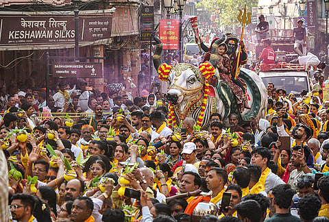 Artists dressed as Lord Shiva and Goddess Parvati take part in the annual 'Kalash' procession to Kashi Vishwanath Temple on the 'Nirjala Ekadashi', in Varanasi, Uttar Pradesh.