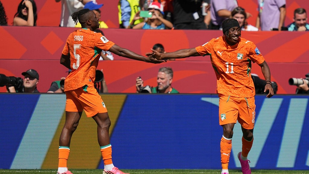 Ivory Coast's Wilfried Singo, left and teammate Ivory Coast's Wilfried Singo celebrate after Ivory Coast's Franck Kessie scored the opening goal during the World Cup Group E soccer match between Germany and Ivory Coast. - Stephanie Scarbrough/AP Photo