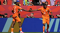 Stephanie Scarbrough/AP Photo : Ivory Coast's Wilfried Singo, left and teammate Ivory Coast's Wilfried Singo celebrate after Ivory Coast's Franck Kessie scored the opening goal during the World Cup Group E soccer match between Germany and Ivory Coast.
