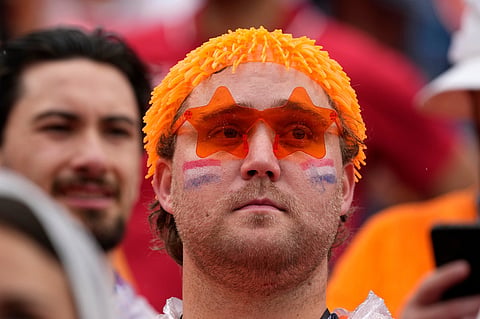A Netherlands fan looks on before the World Cup Group F soccer match between Tunisia and the Netherlands in Kansas City
