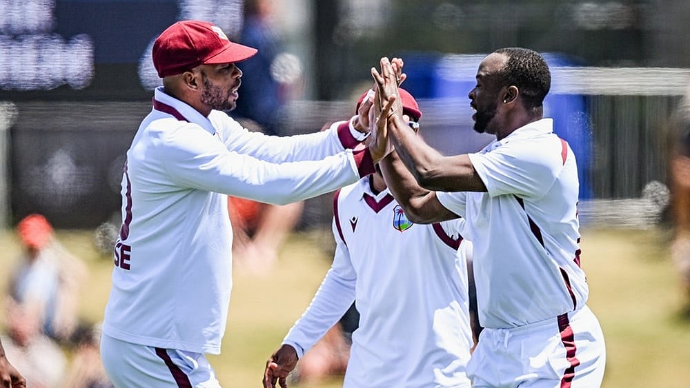 West Indies' Kemar Roach, right, and teammate Roston Chase celebrate the wicket of New Zealand's Kane Williamson on day 3 during their cricket test match in Christchurch, New Zealand. - | Photo: Andrew Cornaga/Photosport via AP