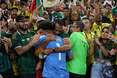 South Africa goalkeeper Ronwen Williams (1) is embraced by supporters after the World Cup Group A soccer match between South Africa and South Korea in Guadalupe, near Monterrey, Mexico, Wednesday, June 24, 2026.