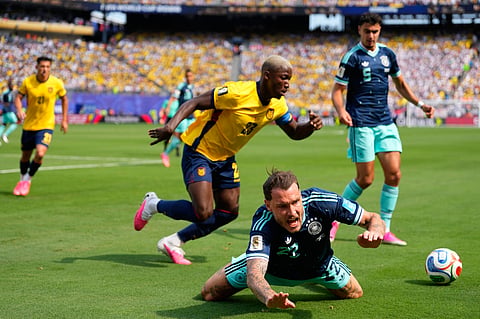 Germany's David Raum falls during the World Cup Group E soccer match against Ecuador in East Rutherford, N.J., near New York, Thursday, June 25, 2026.