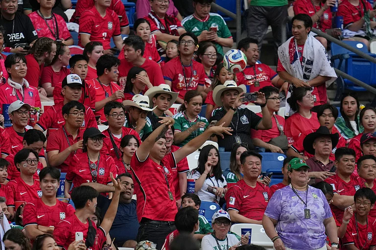 A fan throws back a stray ball ahead of the World Cup Group A soccer match between South Africa and South Korea in Guadalupe, near Monterrey, Mexico, Wednesday, June 24, 2026. - (AP Photo/Matias Delacroix)