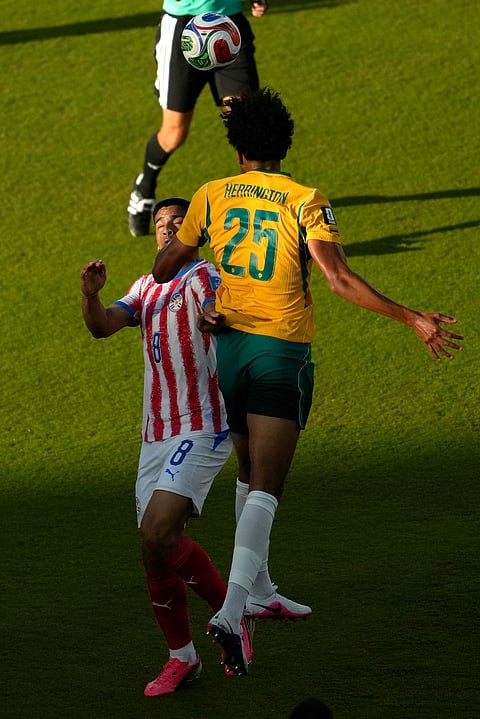 Australia's Lucas Herrington (25) heads the ball against Paraguay's Diego Gomez (8) during the World Cup Group D soccer match between Paraguay and Australia in Santa Clara, Calif., near San Francisco, Thursday, June 25, 2026.