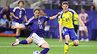 Sam Hodde/AP Photo : Japan's Daizen Maeda (11) scores his team's first goal as Sweden's Alexander Bernhardsson (21) watches during the World Cup Group F soccer match between Japan and Sweden in Arlington