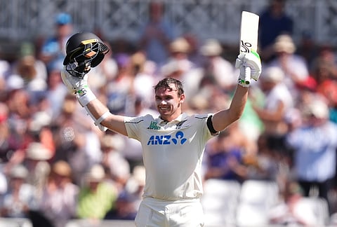New Zealand's Tom Latham celebrates reaching a century, during day one of the Third Test cricket match between England and New Zealand, in Nottingham, England.