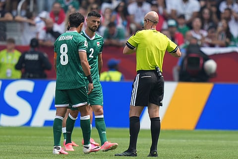 Iraq's Rebin Ghareeb (2) leaves the pitch after receiving a red card during the World Cup Group I soccer match between Senegal and Iraq in Toronto, Friday, June 26, 2026.
