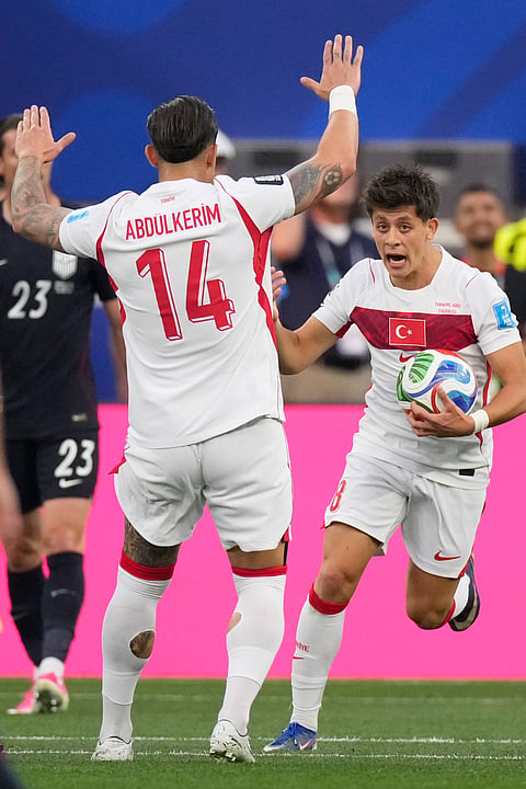 Turkey's Arda Guler, right, celebrates scoring their first goal against the United States during a World Cup Group D soccer match in Inglewood, Calif., near Los Angeles, Thursday, June 25, 2026.