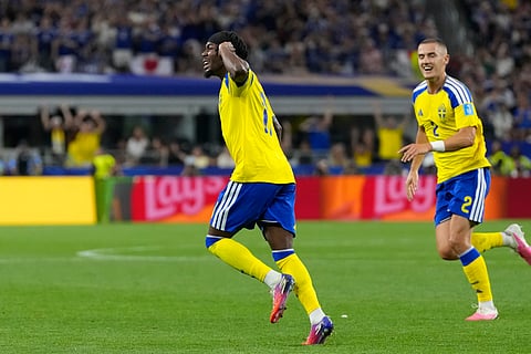 Sweden's Anthony Elanga, left, celebrates scoring his side's opening goal against Japan during the World Cup Group F soccer match in Arlington, Texas, near Dallas, Thursday, June 25, 2026.