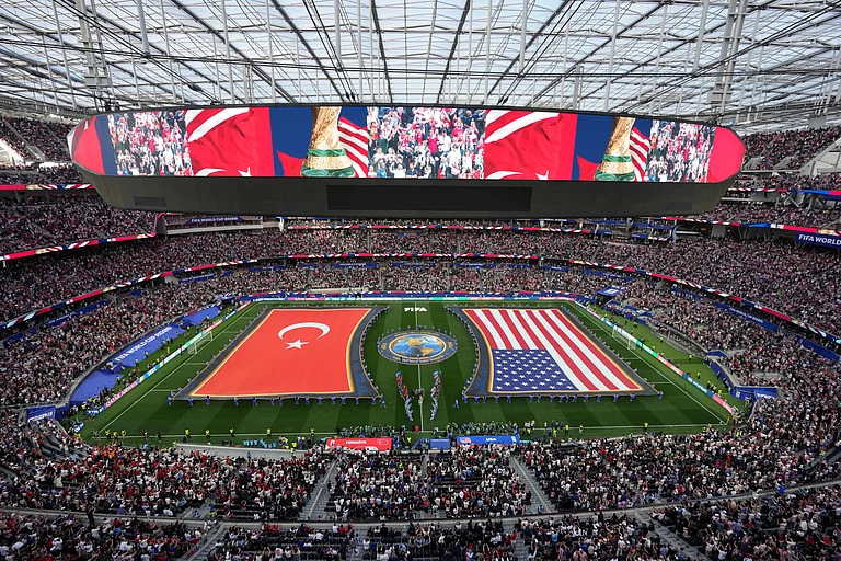 The United States and Turkey players walk on the pitch prior to a World Cup Group D soccer match in Inglewood, Calif., near Los Angeles, Thursday, June 25, 2026. - (AP Photo/Marcio J. Sanchez)