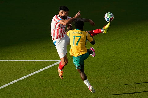 Paraguay's Omar Alderete (3) kicks the ball over Australia's Nestory Irankunda (17) during the World Cup Group D soccer match between Paraguay and Australia in Santa Clara, Calif., near San Francisco, Thursday, June 25, 2026.