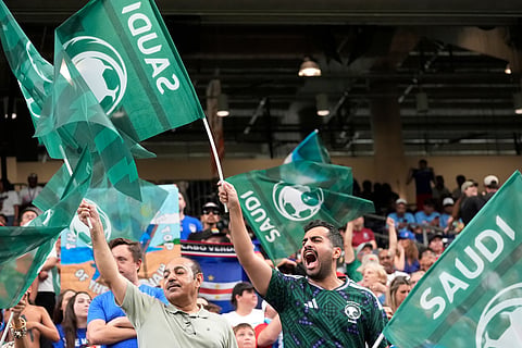 Saudi Arabia fans wave flags prior to a World Cup Group H soccer match between Cape Verde and Saudi Arabia in Houston, Friday, June 26, 2026.