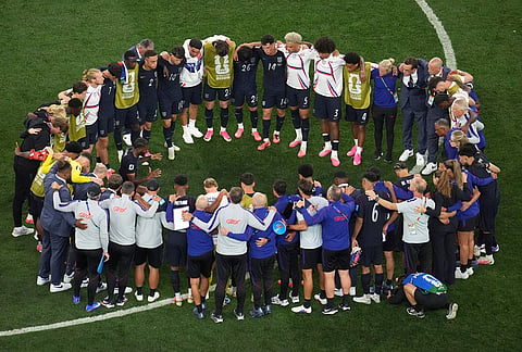 United States players and coaches huddle up after a World Cup Group D soccer match between Turkey and the United States in Inglewood, California, near Los Angeles,.