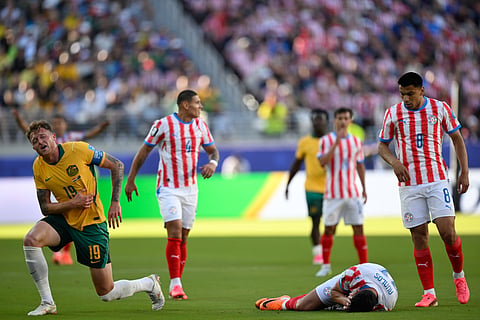 Paraguay's Gabriel Avalos (21) and Australia's Harry Souttar (19) react during the World Cup Group D soccer match between Paraguay and Australia in Santa Clara, Calif., near San Francisco, Thursday, June 25, 2026.