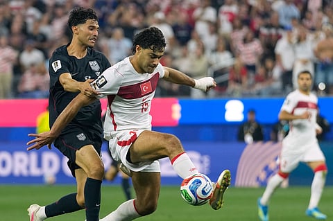 Turkey's Ozan Kabak (15) and United States' Ricardo Pepi battle for the ball during the World Cup Group D soccer match in Inglewood, Calif., near Los Angeles, Thursday, June 25, 2026.