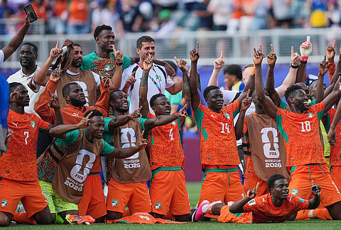 Ivory Coast players celebrate at the end of the World Cup Group E soccer match between Curacao and Ivory Coast in Philadelphia.