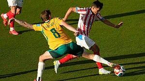 (AP Photo/Jeff Chiu) : araguays Andres Cubas (14) is challenged by Australias Connor Metcalfe (8) during the World Cup Group D soccer match between Paraguay and Australia in Santa Clara, Calif., near San Francisco, Thursday, June 25, 2026