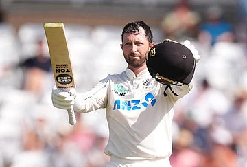 | Photo: Mike Egerton/PA via AP : New Zealand's Devon Conway celebrates reaching a century during day one of the Third Test cricket match between England and New Zealand, in Nottingham, England.