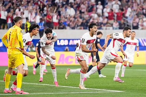 Turkey's Kaan Ayhan, right, celebrates scoring his side's third goal against the United States during a World Cup Group D soccer match in Inglewood, Calif., near Los Angeles, Thursday, June 25, 2026.