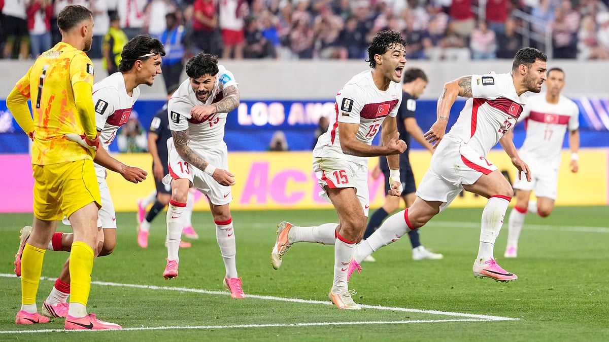 Turkey's Kaan Ayhan, right, celebrates scoring his side's third goal against the United States during a World Cup Group D soccer match in Inglewood, Calif., near Los Angeles, Thursday, June 25, 2026. - (AP Photo/Mark J. Terrill)