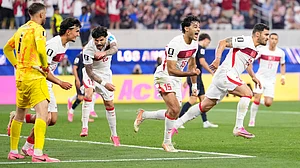 (AP Photo/Mark J. Terrill) : Turkey's Kaan Ayhan, right, celebrates scoring his side's third goal against the United States during a World Cup Group D soccer match in Inglewood, Calif., near Los Angeles, Thursday, June 25, 2026.
