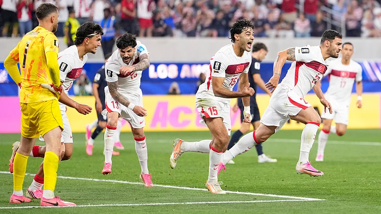 Turkey's Kaan Ayhan, right, celebrates scoring his side's third goal against the United States during a World Cup Group D soccer match in Inglewood, Calif., near Los Angeles, Thursday, June 25, 2026. - (AP Photo/Mark J. Terrill)