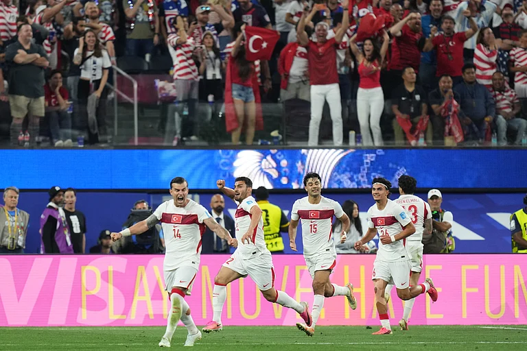 Turkey's Kaan Ayhan (22) celebrates scoring his side's third goal against the United States during the World Cup Group D soccer match in Inglewood, Calif., near Los Angeles, Thursday, June 25, 2026 - (AP Photo/Andre Penner)