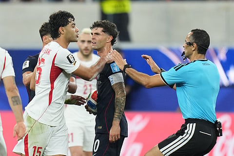 United States' Christian Pulisic, center, and Turkey's Ozan Kabak argue during the World Cup Group D soccer match in Inglewood, Calif., near Los Angeles, Thursday, June 25, 2026.