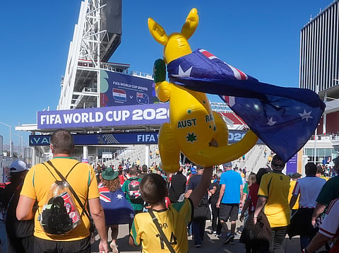 A young Australia fan carries an inflatable kangaroo into the stadium during the World Cup Group D soccer match between Paraguay and Australia in Santa Clara, Calif., near San Francisco, Thursday, June 25, 2026.
