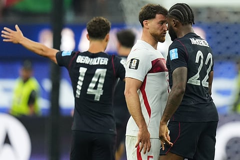 United States' Mark McKenzie (22) and Turkey's Salih Ozcan stare at each other during the World Cup Group D soccer match in Inglewood, Calif., near Los Angeles, Thursday, June 25, 2026.