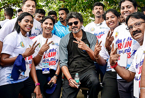 Tamil Nadu Chief Minister Joseph Vijay in a photograph with the participants during the launch of 'Start Run Stop Drugs' anti-drug awareness run on International Day Against Drug Abuse and Illicit Trafficking, in Chennai. 