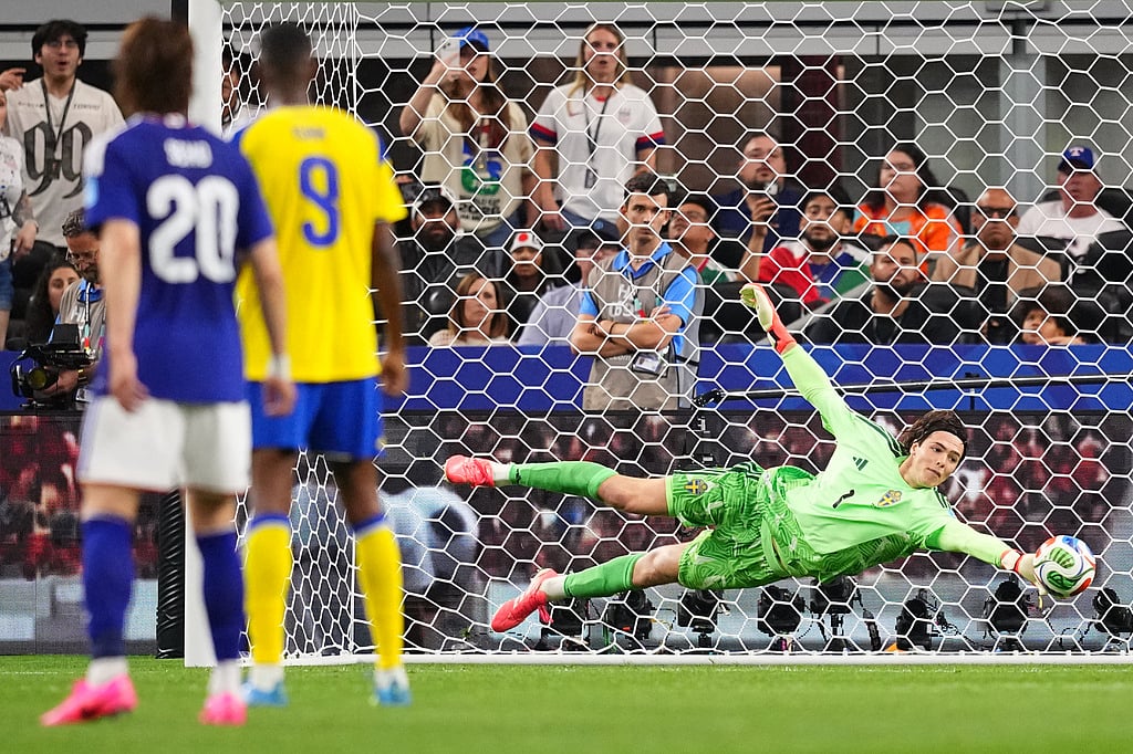 Sweden goalkeeper Jacob Widell Zetterstrom stops a ball during the World Cup Group F soccer match against Japan in Arlington - AP Photo/Julio Cortez