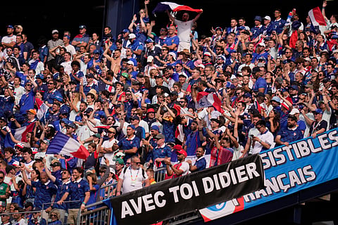 France fans cheer for their national team during the World Cup Group I soccer match between Norway and France in Foxborough