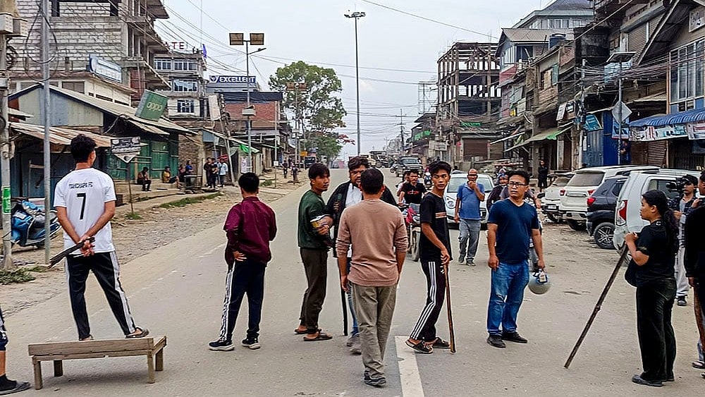 People block a road amid the ensuing ethnic conflict - | Photo: PTI