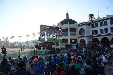 Fans watch a World Cup Group D soccer match between the United States and Turkey on Thursday, June 25, 2026, on the beach in Santa Cruz, Calif.