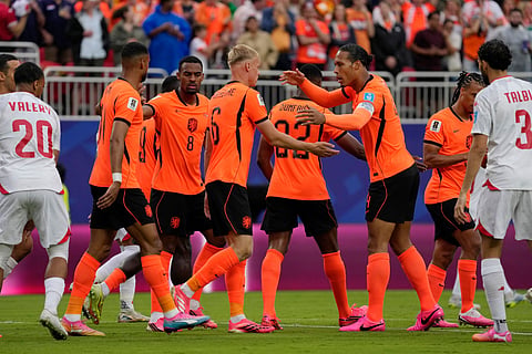 Netherlands players celebrate Tunisia's own goal during the World Cup Group F soccer match between Tunisia and the Netherlands in Kansas City, Mo., Thursday, June 25, 2026.