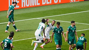 (AP Photo/Olivia White) : Senegal's Pape Gueye (26) celebrates with Iliman Ndiaye (13) after scoring the team's fourth goal during the World Cup Group I soccer match between Senegal and Iraq in Toronto, Friday, June 26, 2026.
