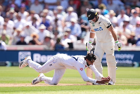 England's Shoaib Bashir claims the ball, during day one of the Third Test cricket match between England and New Zealand, in Nottingham, England.