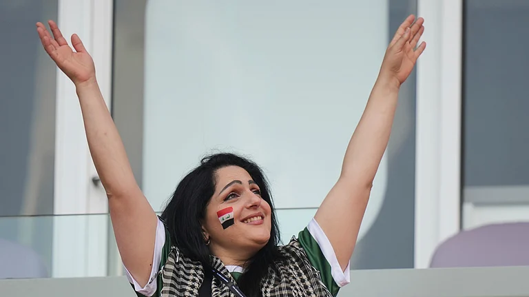 A fan of Iraq waves her hands ahead of the World Cup Group I soccer match between Senegal and Iraq in Toronto, Friday, June 26, 2026. - (AP Photo/Stephanie Scarbrough)