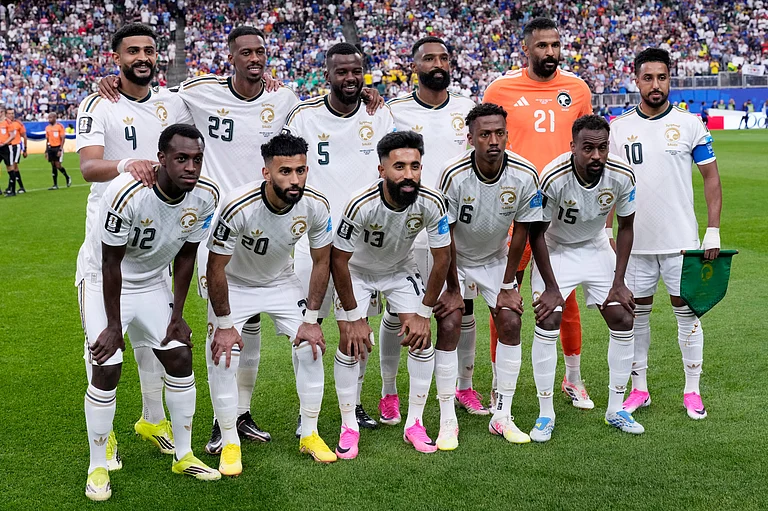 Saudi Arabia starting players pose for a group photo prior to a World Cup Group H soccer match between Cape Verde and Saudi Arabia in Houston, Friday, June 26, 2026. - (AP Photo/David J. Phillip)