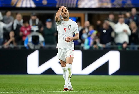 Iran's Shoja Khalilzadeh (4) reacts during the World Cup Group G soccer match between Egypt and Iran in Seattle.