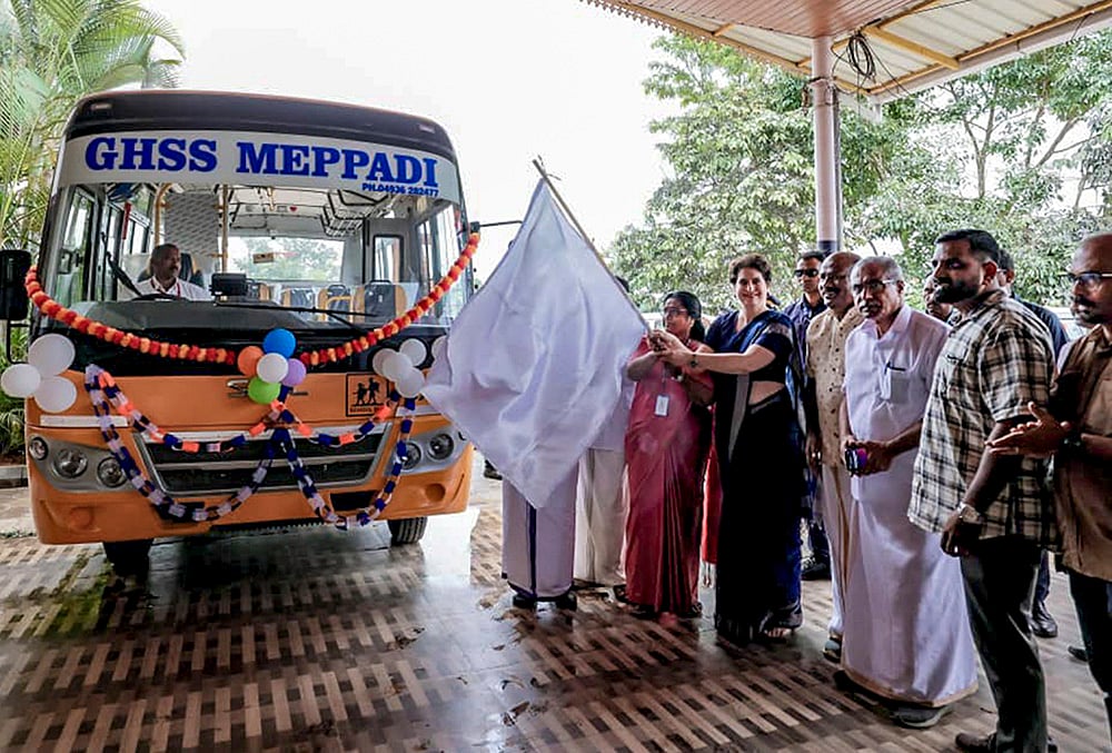 Priyanka Gandhi Vadra flags off a school bus at GHSS Meppadi in Wayanad