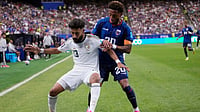 (AP Photo/David J. Phillip) : Saudi Arabia's Nawaf Bu Washl (13) keeps the ball away from Cape Verde's Ryan Mendes (20) during the first half of the World Cup Group H soccer match in Houston, Friday, June 26, 2026.