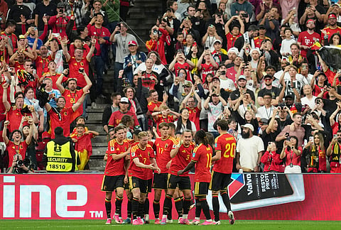 Belgium players celebrate after scoring their second goal during the World Cup Group G soccer match between New Zealand and Belgium in Vancouver, British Columbia.
