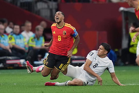 New Zealand's Marko Stamenic (8) tackles Belgium's Youri Tielemans (8) during the second half of a World Cup Group G soccer match in Vancouver, British Columbia.